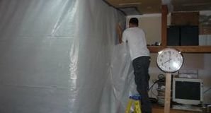 Water Damage Restoration Pro Sealing In Mold Spores With A Vapor Barrier